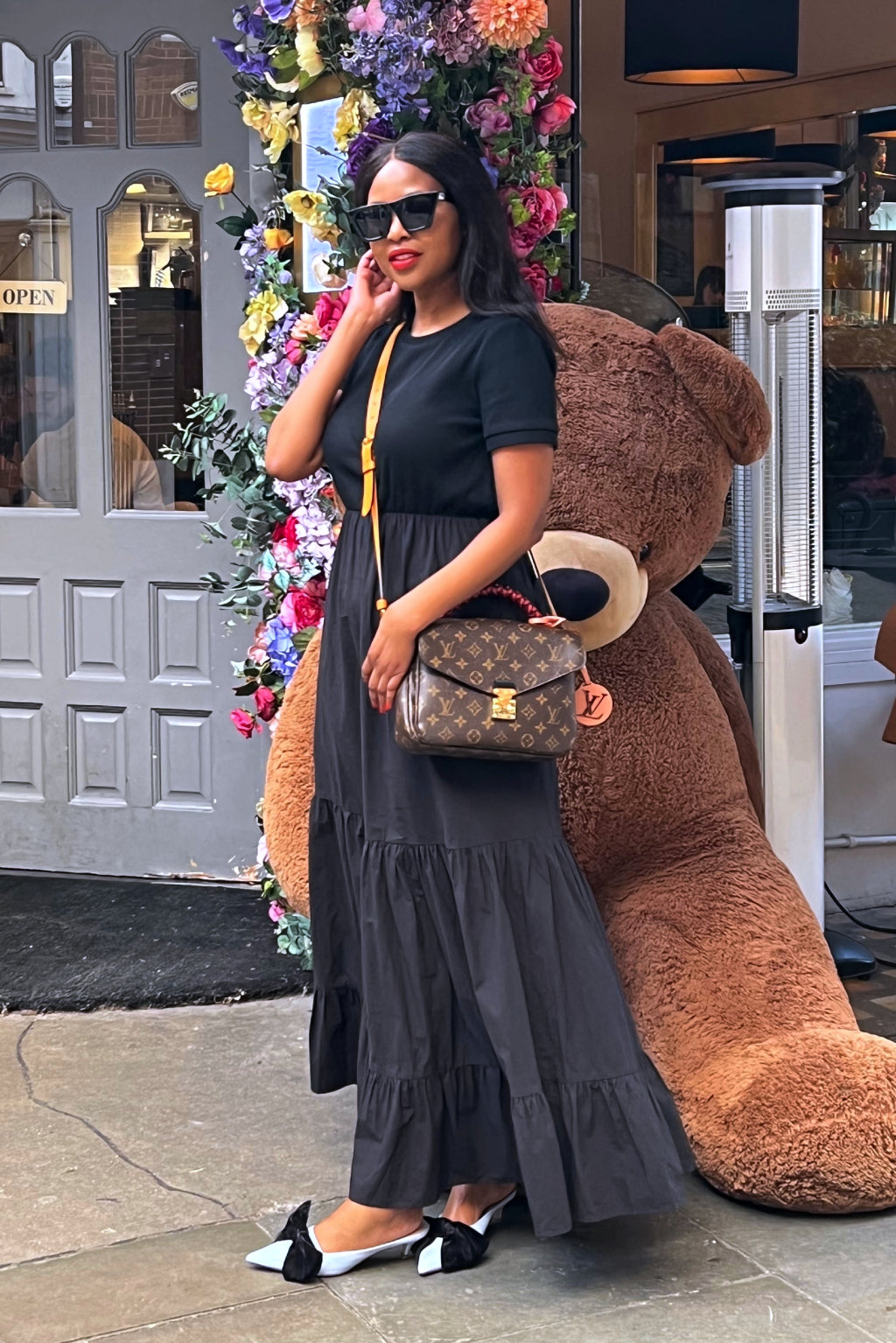 This is a flattering, classic black maxi dress that you'll get a ton of wear out of this season and for years to come