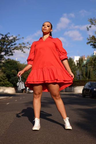 The Red Dress is a great dress that has a midi length and two front pockets. The dress comes with a black belt. Our poplin fabric is light and comfortable to wear. This dress is effortless chic  and oversized, just how we like it.&quot;